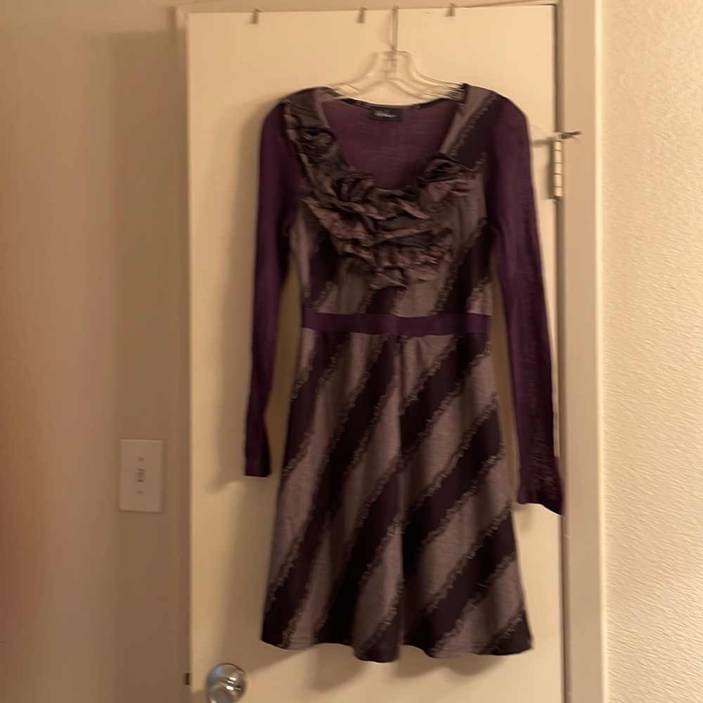 Purple long sleeve dress with diagonal stripes and ruffles on top